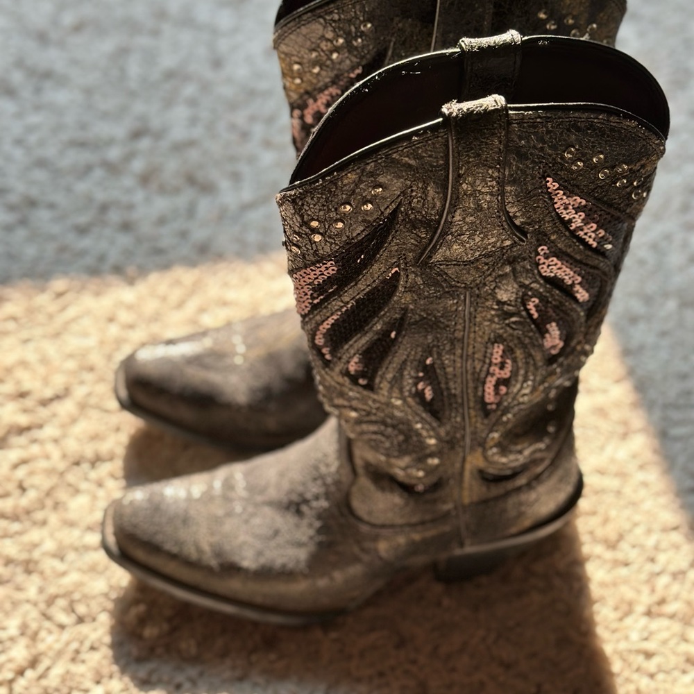 Black boots with sequins. Has a higher heel . Size 6 but fits more like a 7